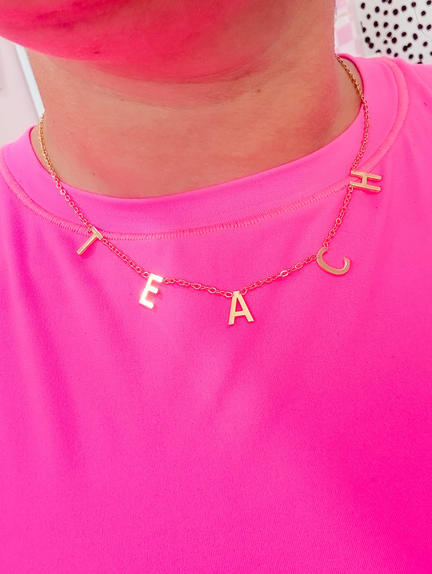 TEACH necklace.